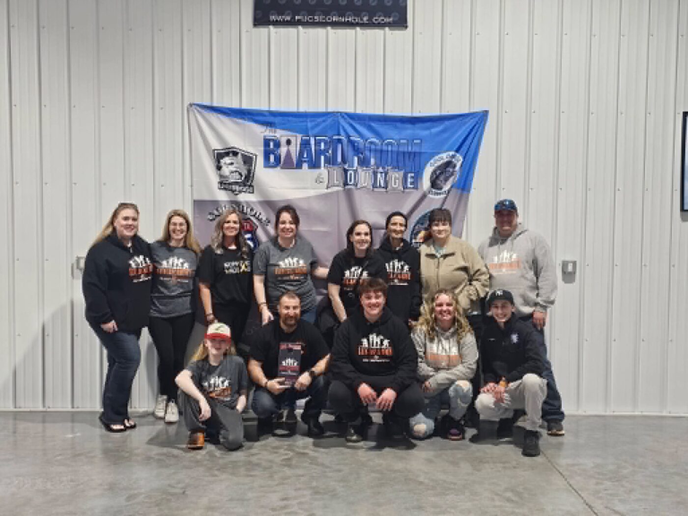 Volunteers and family at the Lucas' Army cornhole tournament