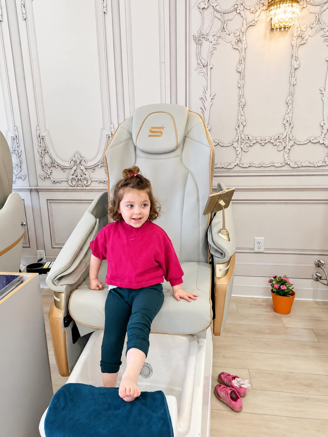 April smiling in a salon chair during her spa day